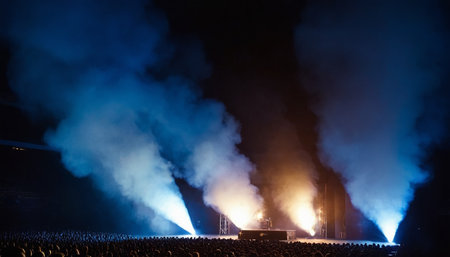 Crowd at concert, lights and smoke on the stage, tonedの素材