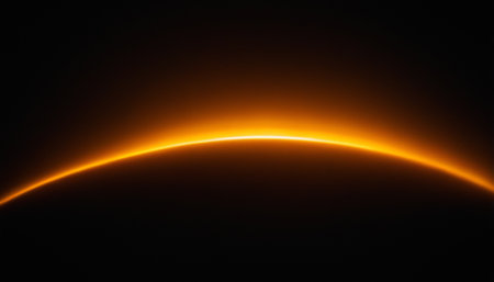 Abstract orange light effect on black background. Futuristic technology style.の素材