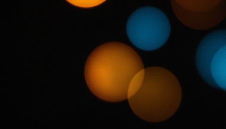 Abstract circular bokeh background, defocused lights on black backgroundの素材