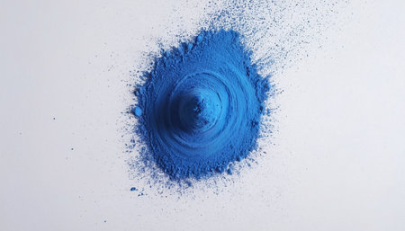 Blue powder explosion isolated on white background. Top view, flat layの素材