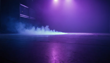 Empty stage with smoke, fog and spotlight. Abstract dark background.の素材