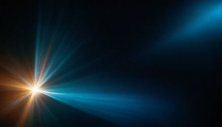 sun burst with lens flare and bokeh effect over black backgroundの素材