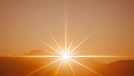 Sunset in the mountains with rays of light and lens flare.の素材