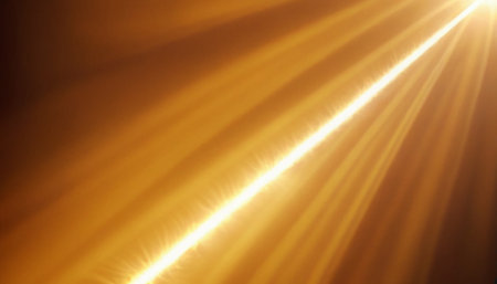 Sun flare on a dark background. Sun rays with lens flare.の素材