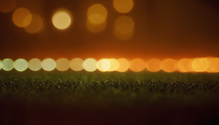 Defocused bokeh lights on football field. Abstract background.の素材