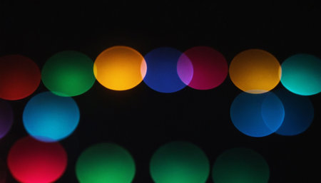 Colorful bokeh lights on black background. Bokeh effect.の素材