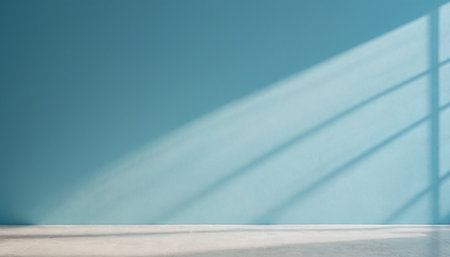 Empty room with blue wall and shadow from window, interior design conceptの素材