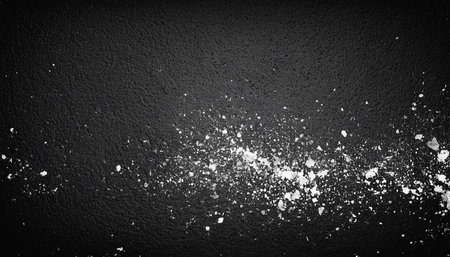 Salt on a black background. Top view. Copy space. Toned.の素材
