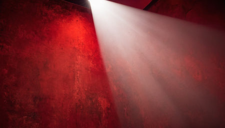 Light from the spotlights on a dark red wall in the studioの素材