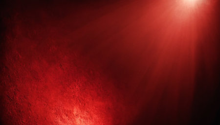 Red grunge textured background with light beams and spotlights.の素材