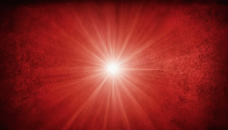 Grunge red background with sun burst and space for your textの素材