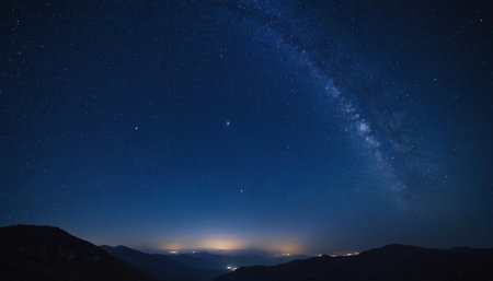 Milky Way over the mountains at night. Long exposure photograph.の素材
