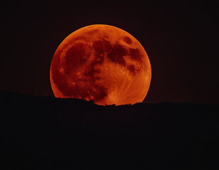 Super red blood moon in the night sky, natural landscape background.の素材