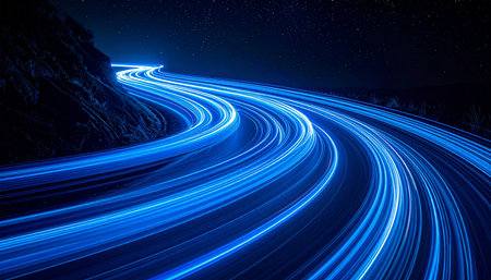 Blue light trails on the road at night. Long exposure photo.の素材