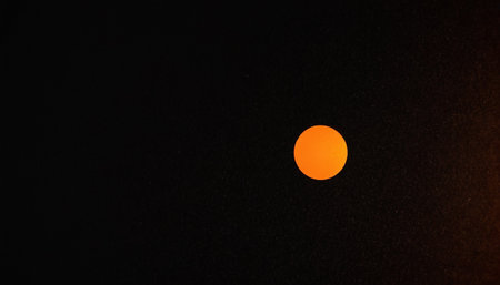 Sunset in the evening sky. The sun behind the clouds.の素材