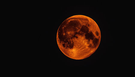 Bloody moon in the night sky, closeup of photo.の素材