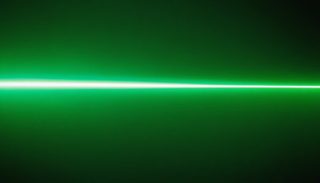 green laser beam on black background. Laser beam in the dark.の素材