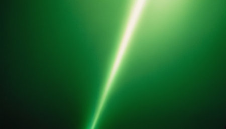 green light beam on black background. close up of green light beam on black backgroundの素材