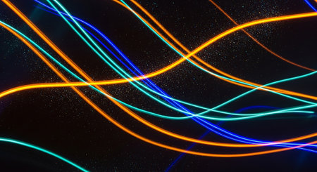 abstract background of blue and orange neon lights on a black backgroundの素材
