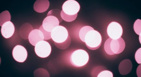 Abstract circular colorful bokeh from the party light on black backgroundの素材