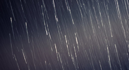 Rainy night sky with stars and falling raindrops. Abstract background.の素材