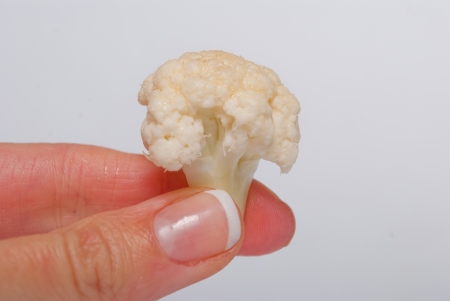 Piece of Cauliflower in the handの写真素材