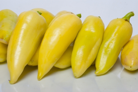 yellow bell peppers om white backgroundの写真素材