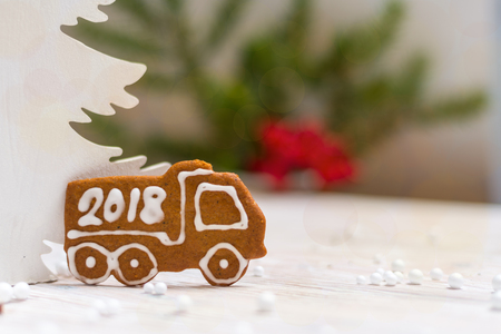 New Year decoration gingerbread truck with Year 2018の写真素材