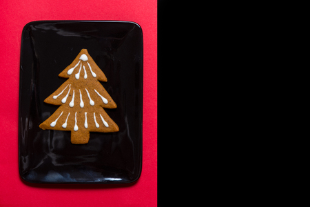 gingerbread cookie on black ceramic plateの写真素材