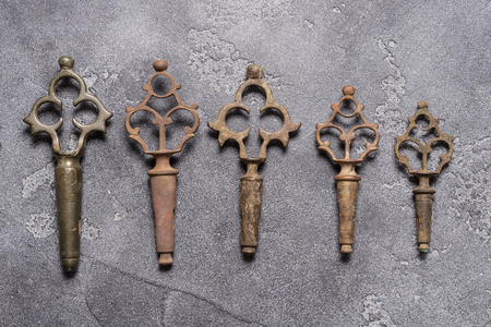 Antique brass tap key on dark background, copy spaceの写真素材