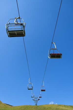summer chairlift on blue sky backgroundの写真素材
