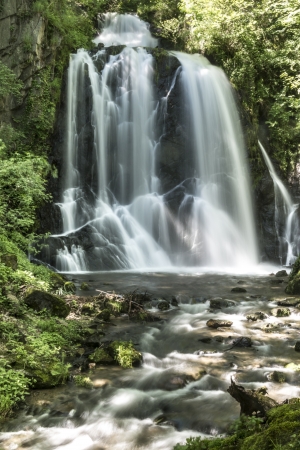 The waterfall Pevereggia in a natural rock amphitheaterの写真素材