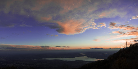 Colorful sunset on the Varese lake in a autumn afternoon vier from regional park of Campo dei Fiori Varese - Lombardy, Italyの写真素材