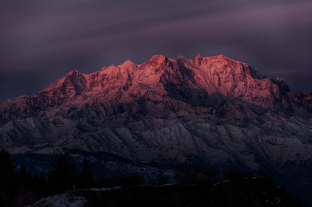 First rays of sun on top of Monte Rosa