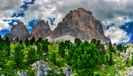 Cloudy sky over the Sassolungo Group seen from Sella Pass, Gardena Valleyの写真素材