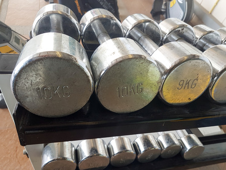 Close up of many dumbbell in fitness centerの写真素材