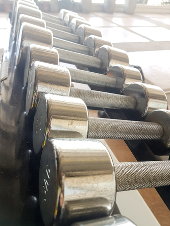 Close up of many dumbbell in fitness centerの写真素材