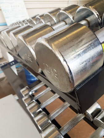 Close up of many dumbbell in fitness centerの写真素材