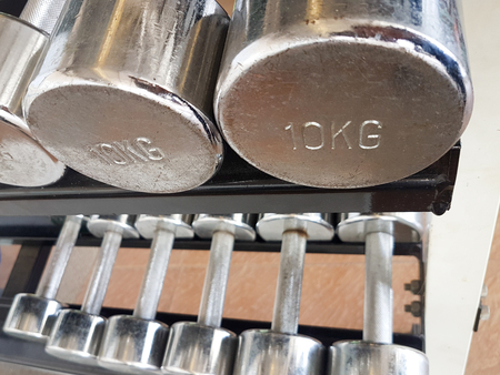 Close up of many dumbbell in fitness centerの写真素材