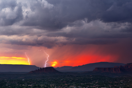 Sunset storm with lightningの写真素材