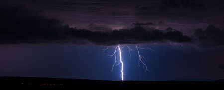 Thunderstorm and lightning bolt in the night sky