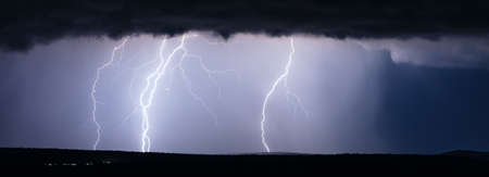 Powerful lightning bolts in a thunderstormの写真素材