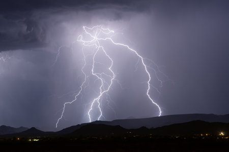 Lightning strike in the night sky over Cave Creek, Arizonaの写真素材