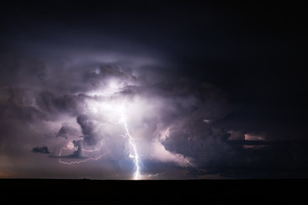 Lightning strikes in the night sky. Thunderstorm and lightning strikeの写真素材