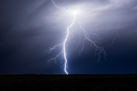 Lightning strike in the night sky. Thunderstorm in Colorado.の写真素材