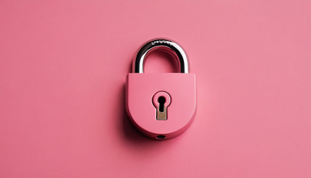 Pink padlock on a pink background, top view, copy spaceの素材