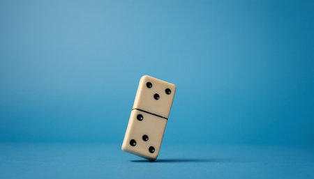 Dominoes on a blue background. Conceptual photo for risk, chance, good luck.の素材