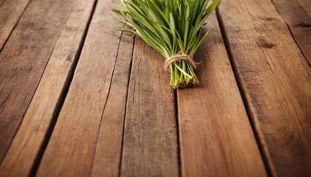 Bunch of grass on a wooden table. Rustic style.の素材