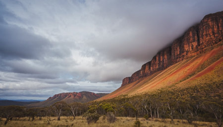 Dramatic sky over a mountain range in Northern Territory, Australiaの素材