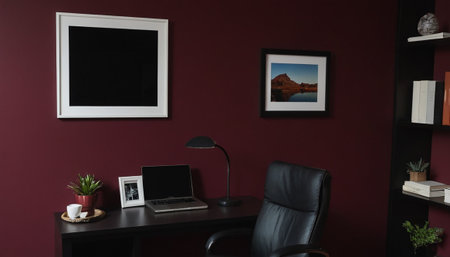 Modern workplace with laptop and bookshelf on dark red wall backgroundの素材